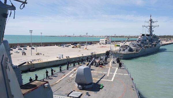 In this photo provided by the U.S. Navy, the Arleigh Burke-class guided-missile destroyer USS Ross (DDG 71) departs Rota, Spain, on March 29, 2017. - Sputnik Moldova-România