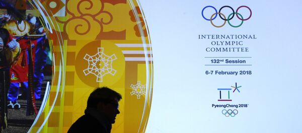 A member of the International Olympic Committee walks past a display during the 132nd IOC Session prior to the 2018 Winter Olympics in Pyeongchang, South Korea, Wednesday, Feb. 7, 2018 - Sputnik Moldova-România
