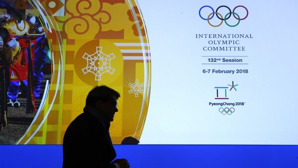 A member of the International Olympic Committee walks past a display during the 132nd IOC Session prior to the 2018 Winter Olympics in Pyeongchang, South Korea, Wednesday, Feb. 7, 2018 - Sputnik Moldova-România