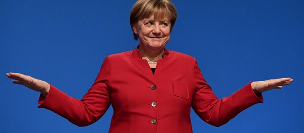 German Chancellor Angela Merkel gestures after addressing delegates during her conservative Christian Democratic Union (CDU) party's congress in Essen, western Germany, on December 6, 2016. - Sputnik Молдова