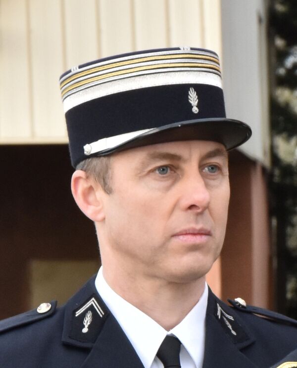 A photo released by the French Gendarmerie shows Lieutenant-Colonel Arnaud Beltrame, the gendarme who voluntarily took the place of a hostage during a deadly supermarket siege in southwestern France on Friday, March 23, 2018. A photo released by the French Gendarmerie shows Lieutenant-Colonel Arnaud Beltrame, the gendarme who voluntarily took the place of a hostage during a deadly supermarket siege in southwestern France on Friday, March 23, 2018. - Sputnik Moldova-România