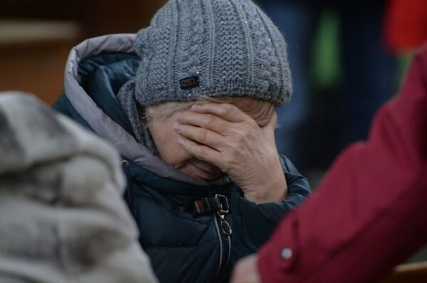 Родственница одного из пропавших без вести при пожаре в торговом центре Зимняя вишня в Кемерово. - Sputnik Молдова