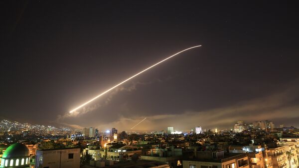 Damascus sky lights up with service to air missile fire as the U.S. launches an attack on Syria targeting different parts of the Syrian capital Damascus, Syria, early Saturday, April 14, 2018. - Sputnik Moldova-România