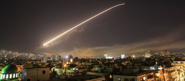 The Damascus sky lights up missile fire as the U.S. launches an attack on Syria targeting different parts of the capital early Saturday, April 14, 2018 - Sputnik Moldova