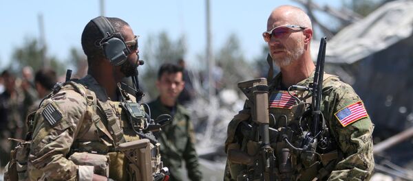 US forces are seen at the Kurdish People's Protection Units (YPG) headquarters after it was hit by Turkish airstrikes in Mount Karachok near Malikiya, Syria April 25, 2017. - Sputnik Moldova-România