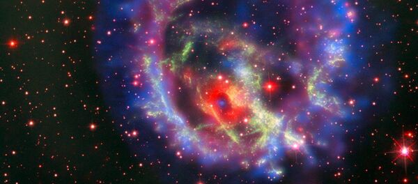 Остатки сверхновой 1E 0102.2-7219, расположенной в ближайшей к нам галактике Малое Магелланово Облако Остатки сверхновой 1E 0102.2-7219, расположенной в ближайшей к нам галактике Малое Магелланово Облако - Sputnik Молдова