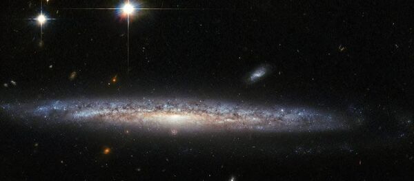 Галактики NGC 5714 и NGC 1787, снятые телескопом Хаббл Галактики NGC 5714 и NGC 1787, снятые телескопом Хаббл - Sputnik Moldova-România