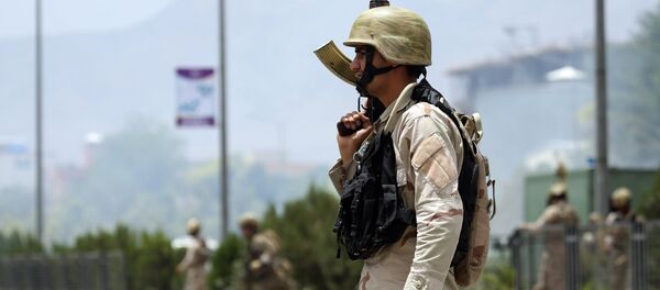 Afghan security forces gather at the site of an attack by Taliban fighters outside the parliament in Kabul, Afghanistan, Monday, June 22, 2015 Afghan security forces gather at the site of an attack by Taliban fighters outside the parliament in Kabul, Afghanistan, Monday, June 22, 2015 - Sputnik Moldova