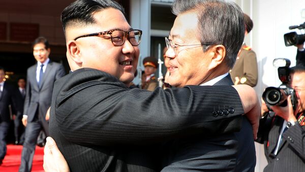 South Korean President Moon Jae-in bids fairwell to North Korean leader Kim Jong Un as he leaves after their summit at the truce village of Panmunjom, North Korea, in this handout picture provided by the Presidential Blue House on May 26, 2018 - Sputnik Moldova-România