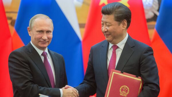 Wladimir Putin und Xi Jinping in China - Sputnik Молдова
