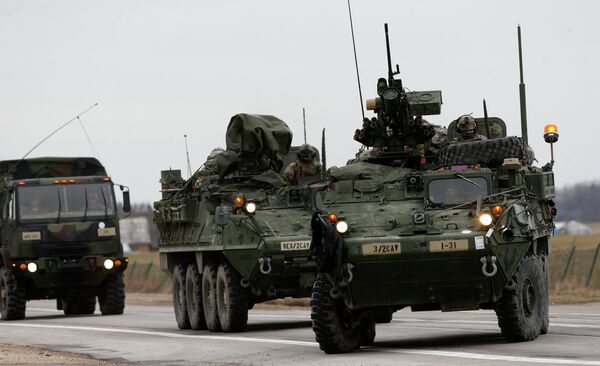 (File) Stryker vehicles of the US Army’s 2nd Cavalry Regiment roll down the way during the ''Dragoon Ride'' military exercise in Salociai some 178 kms (110 miles) north of the capital Vilnius, Lithuania, Monday, March 23, 2015 - Sputnik Молдова