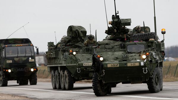 (File) Stryker vehicles of the US Army’s 2nd Cavalry Regiment roll down the way during the ''Dragoon Ride'' military exercise in Salociai some 178 kms (110 miles) north of the capital Vilnius, Lithuania, Monday, March 23, 2015 - Sputnik Moldova-România