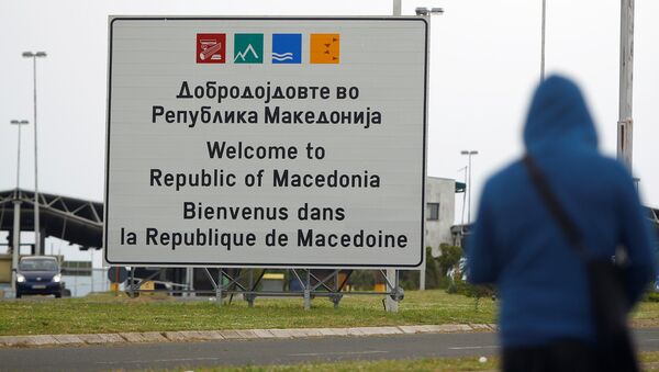 A person walks near a sign that reads welcome to Macedonia at the Macedonia-Greece border April 16, 2018 - Sputnik Молдова