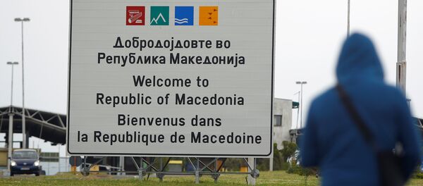 A person walks near a sign that reads welcome to Macedonia at the Macedonia-Greece border April 16, 2018 - Sputnik Молдова