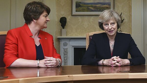 This is a July 25, 2016 file photo of of Arlene Foster, left, leader of the Democratic Unionist Party, with Britain's Prime Minister Theresa May, during a meeting in Belfast. - Sputnik Moldova-România