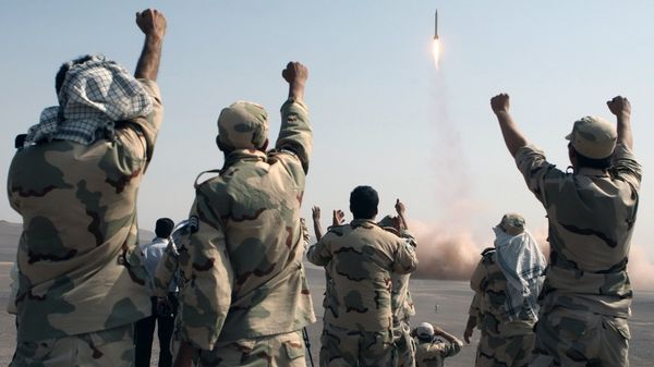 In this photo released by the Islamic Republic News Agency (IRNA), members of the Iranian Revolutionary Guard celebrate after launching a missile during their maneuver in an undisclosed location in Iran (File) - Sputnik Moldova