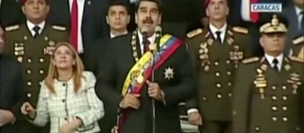 Venezuelan President Nicolas Maduro reacts during an event which was interrupted, in this still frame taken from video August 4, 2018, Caracas, Venezuela. Venezuelan President Nicolas Maduro reacts during an event which was interrupted, in this still frame taken from video August 4, 2018, Caracas, Venezuela. - Sputnik Moldova-România