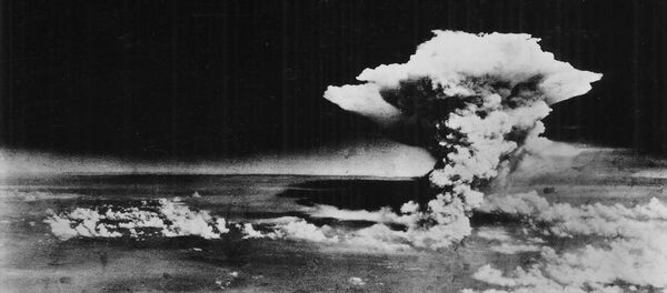 An atomic cloud billows above Hiroshima city following the explosion of the first atomic bomb to be used in warfare in Hiroshima, in this handout photo taken by the US Army on August 6, 1945, and distributed by the Hiroshima Peace Memorial Museum. - Sputnik Moldova