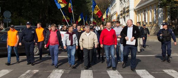 Левоцентристская оппозиция пикетировала во вторник здания Генпрокуратуры, Национального агентства по регулированию в энергетике и мэрии Кишинева. Левоцентристская оппозиция пикетировала во вторник здания Генпрокуратуры, Национального агентства по регулированию в энергетике и мэрии Кишинева. - Sputnik Молдова