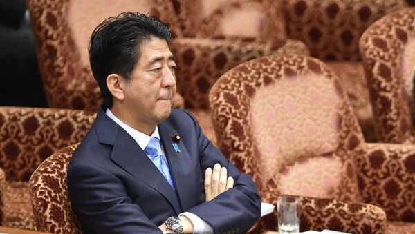 Japan's Prime Minister Shinzo Abe attends an upper house special committee session at the parliament in Tokyo on July 28, 2015. - Sputnik Moldova-România