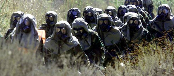 Солдаты НАТО в противогазах, архивное фото. Солдаты НАТО в противогазах, архивное фото. - Sputnik Молдова