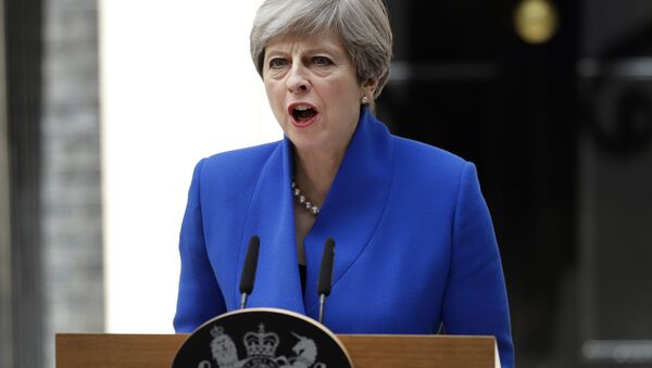 British Prime Minister Theresa May addresses the press in Downing street, London, Friday, June 9, 2017 following an audience with Britain's Queen Elizabeth II at Buckingham Palace where she asked to form a government.  - Sputnik Moldova-România