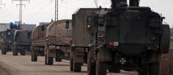 Turkish military vehicles drive in the Syrian rebel-held town of al-Rai, as they head towards the northern Syrian town of al-Bab, Syria January 9, 2017 - Sputnik Moldova-România