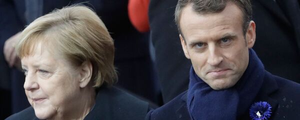 Президент Франции Эммануэль Макрон и канцлер Германии Ангела Меркель во время торжеств, приуроченных к столетию окончания Первой мировой войны. Президент Франции Эммануэль Макрон и канцлер Германии Ангела Меркель во время торжеств, приуроченных к столетию окончания Первой мировой войны. - Sputnik Молдова