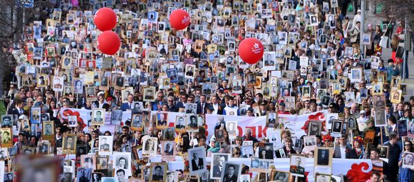 Участники акции Бессмертный полк в Казани Участники акции Бессмертный полк в Казани - Sputnik Молдова