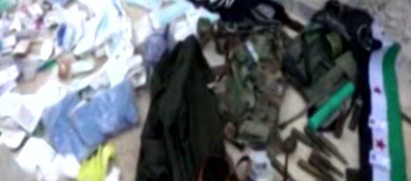 Сирийские военные захватили оружие и форму террористов в Тель-Скеке Сирийские военные захватили оружие и форму террористов в Тель-Скеке - Sputnik Moldova