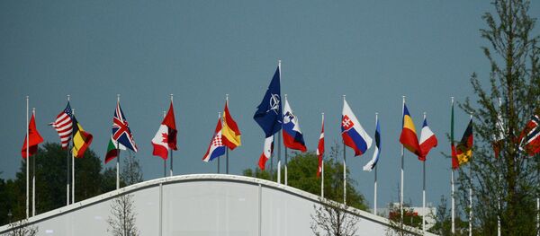 Флаги стран-участниц НАТО над офисом НАТО в Брюсселе, архивное фото - Sputnik Молдова