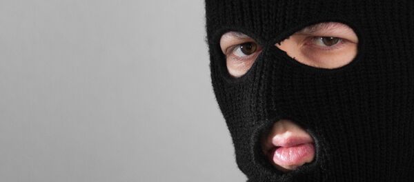 Человек в маске балаклавы. Архивное фото - Sputnik Moldova