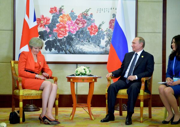 Премьер-министр Великобритании Тереза Мэй и президент РФ Владимир Путин во время встречи в рамках саммита G20 в Ханчжоу - Sputnik Moldova-România