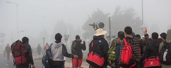Беженцы в специально организованном центре по распределению мигрантов - Sputnik Молдова
