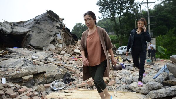 Разрушенные в результате землетрясения дома в городе Ибин, провинция Сычуань, Китай - Sputnik Moldova-România