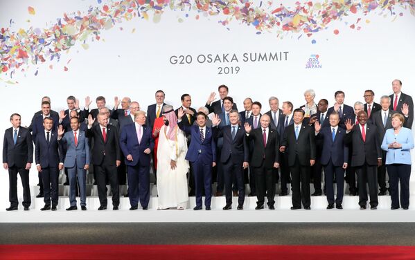 Președintele Rusiei, Vladimir Putin, la ceremonia de fotografiere a șefilor delegațiilor statelor G20, state invitate și organizații internaționale, la Osaka. - Sputnik Moldova