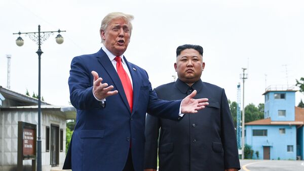 US President Donald Trump speaks as he stands with North Korea's leader Kim Jong Un - Sputnik Moldova-România