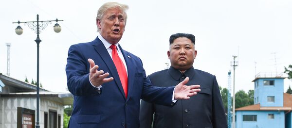 US President Donald Trump speaks as he stands with North Korea's leader Kim Jong Un - Sputnik Moldova-România