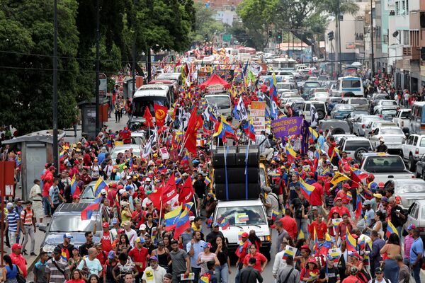 Сторонники венесуэльского правительства во время протеста против санкций США в Каракасе  - Sputnik Moldova-România