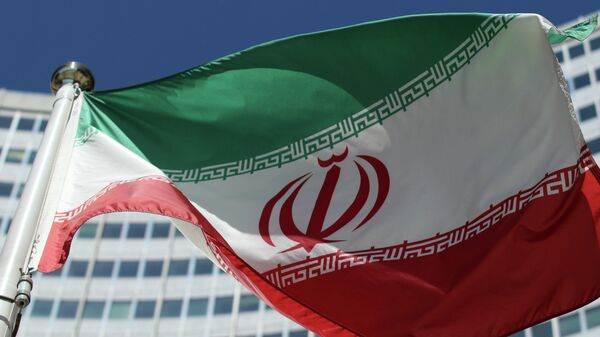 The Iranian flag flies in front of a UN building where closed-door nuclear talks take place at the International Center in Vienna, Austria, Friday, July 4, 2014. - Sputnik Moldova