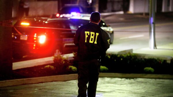 An FBI agent walks across the street from the Emanuel AME Church following a shooting Wednesday, June 17, 2015, in Charleston, S.C. - Sputnik Moldova