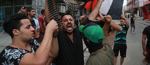 Протестующие во время демонстрации в Багдаде Протестующие во время демонстрации в Багдаде - Sputnik Moldova-România