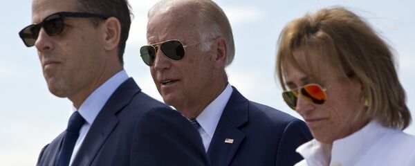 Family members gather for a road naming ceremony with U.S. Vice President Joe Biden, centre, his son Hunter Biden, left, and his sister Valerie Biden Owens, right, joined by other family members during a ceremony to name a national road after his late son Joseph R. Beau Biden III, in the village of Sojevo, Kosovo, on Wednesday, Aug. 17, 2016 - Sputnik Moldova-România