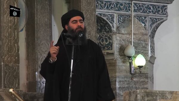 This July 5, 2014 photo shows an image grab taken from a propaganda video released by al-Furqan Media allegedly showing the leader of the Islamic State (IS) jihadist group, Abu Bakr al-Baghdadi, aka Caliph Ibrahim, adressing Muslim worshippers at a mosque in the militant-held northern Iraqi city of Mosul - Sputnik Moldova-România