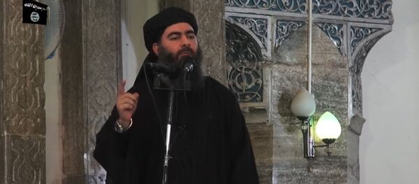 This July 5, 2014 photo shows an image grab taken from a propaganda video released by al-Furqan Media allegedly showing the leader of the Islamic State (IS) jihadist group, Abu Bakr al-Baghdadi, aka Caliph Ibrahim, adressing Muslim worshippers at a mosque in the militant-held northern Iraqi city of Mosul - Sputnik Moldova