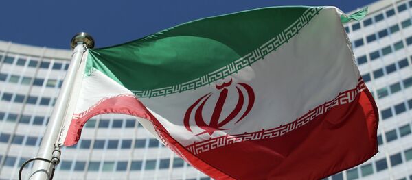 The Iranian flag flies in front of a UN building where closed-door nuclear talks take place at the International Center in Vienna, Austria, Friday, July 4, 2014. - Sputnik Moldova-România