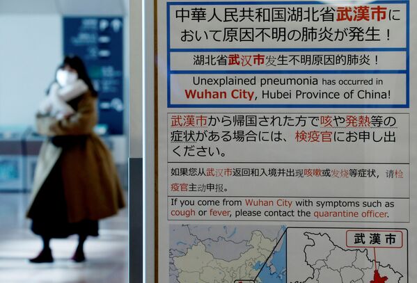 Уведомление о вспышке коронавируса в китайском Ухане в международном аэропорту Токио - Sputnik Молдова