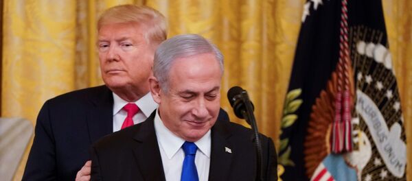 U.S. President Donald Trump puts his hands on Israel's Prime Minister Benjamin Netanyahu's shoulders as they deliver joint remarks on a Middle East peace plan proposal in the East Room of the White House in Washington, U.S., January 28, 2020. - Sputnik Moldova-România