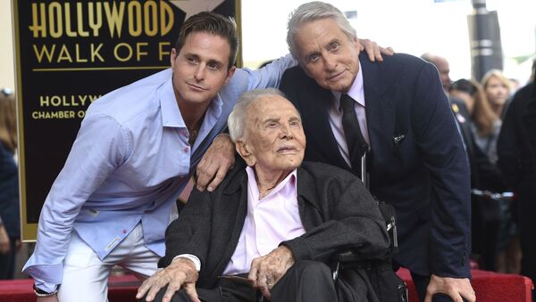 Honoree and actor Michael Douglas, from right, poses with his father actor Kirk Douglas and his son actor Cameron Douglas following a ceremony honoring him with a star on the Hollywood Walk of Fame on Tuesday, Nov. 6, 2018, in Los Angeles. - Sputnik Moldova-România