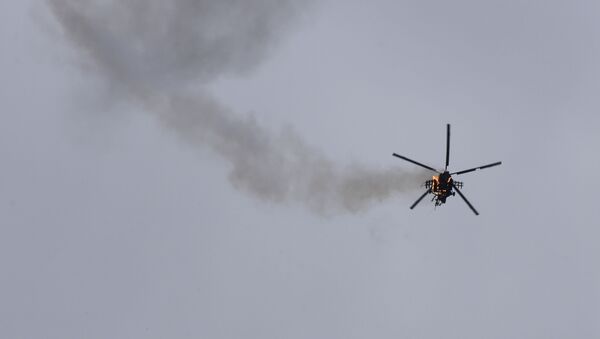 Вертолет правительственной армии Сирии, атакованный ракетой в провинции Идлиб - Sputnik Moldova-România